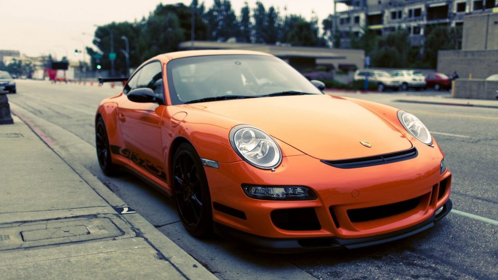 Sleek Flame Orange Porsche Gt3 Rs Fhd Wallpaper